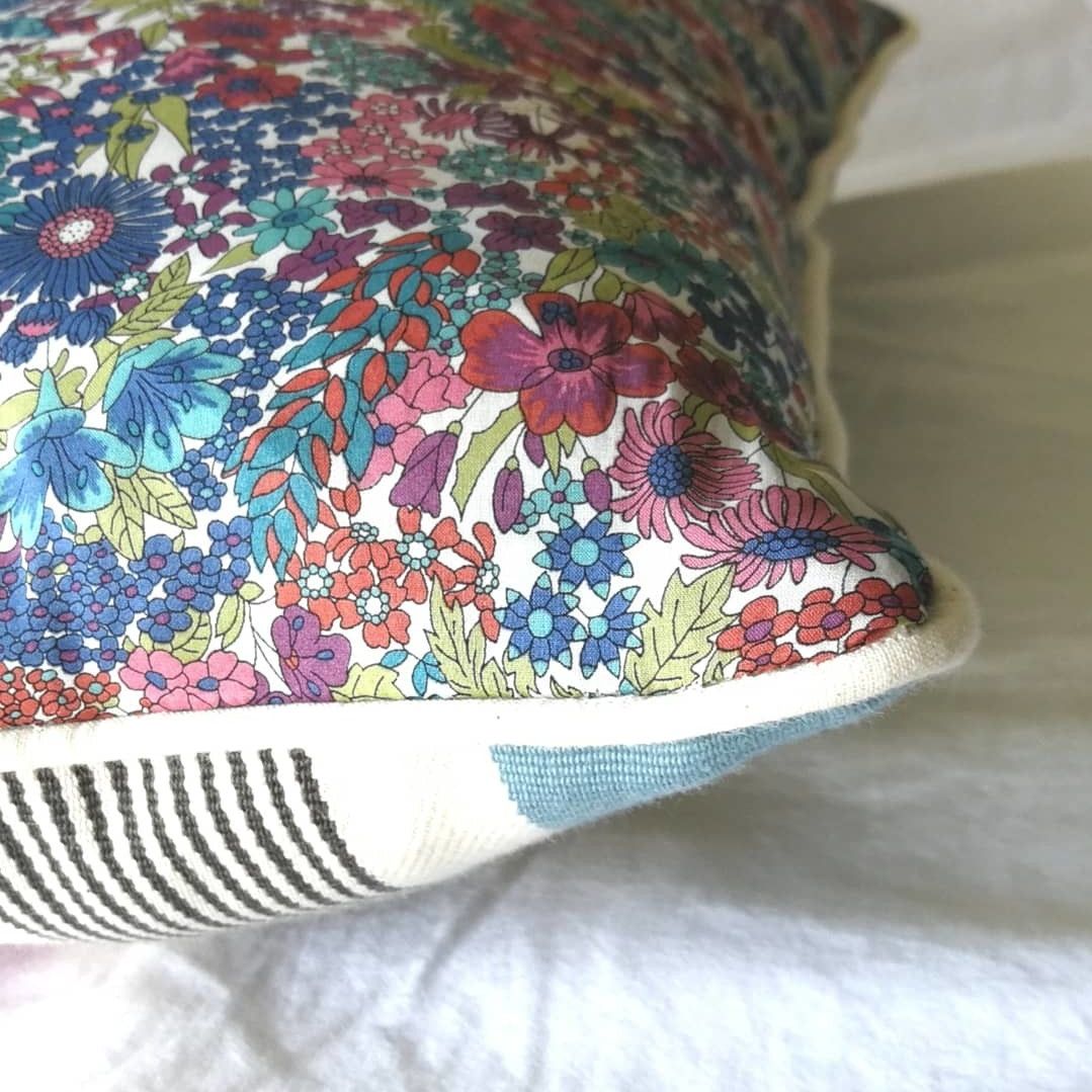 Housse de coussin passepoilée