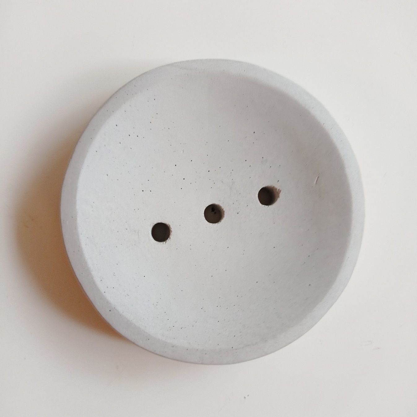 Porte-savons rond en béton gris