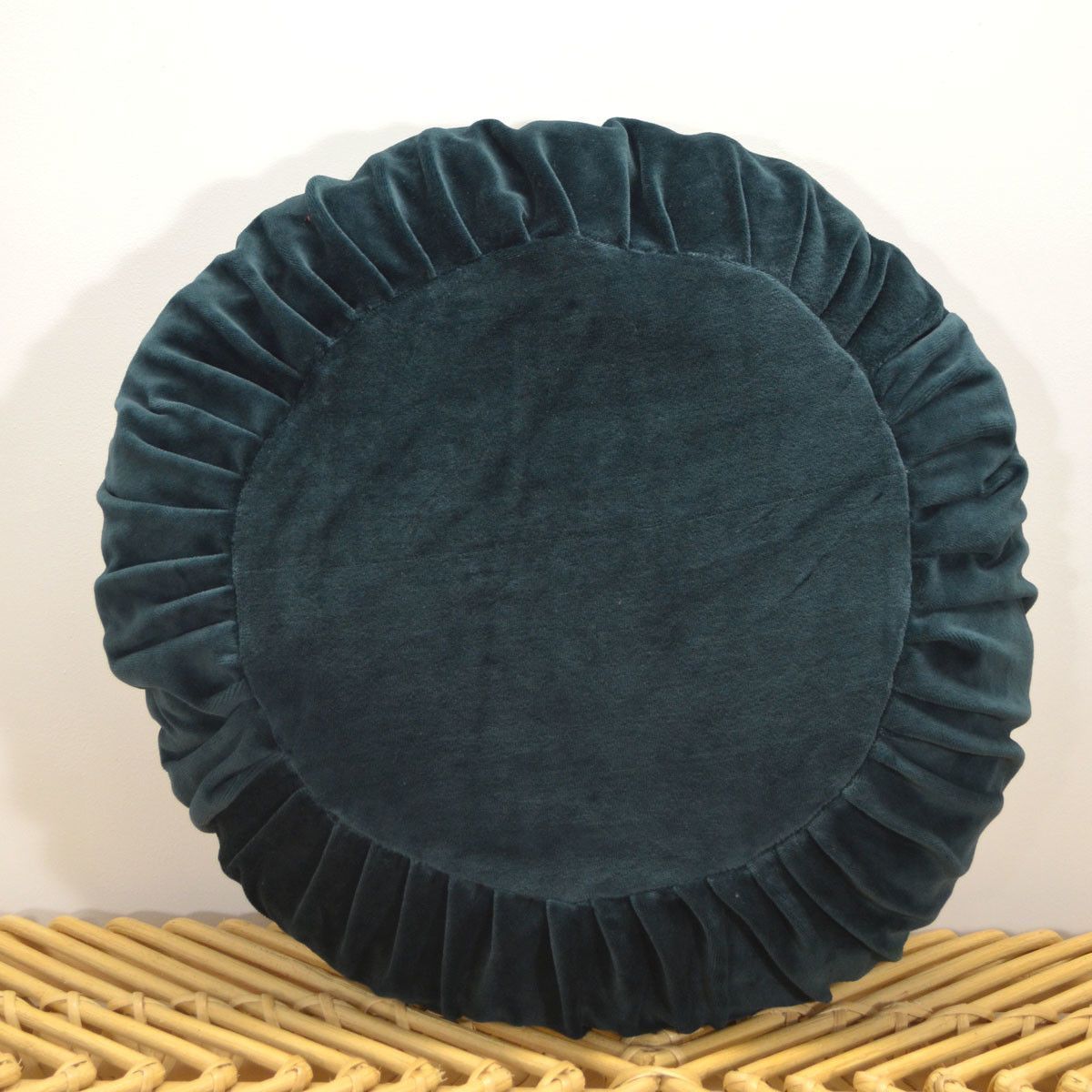 Coussin rond garni en velours plissé