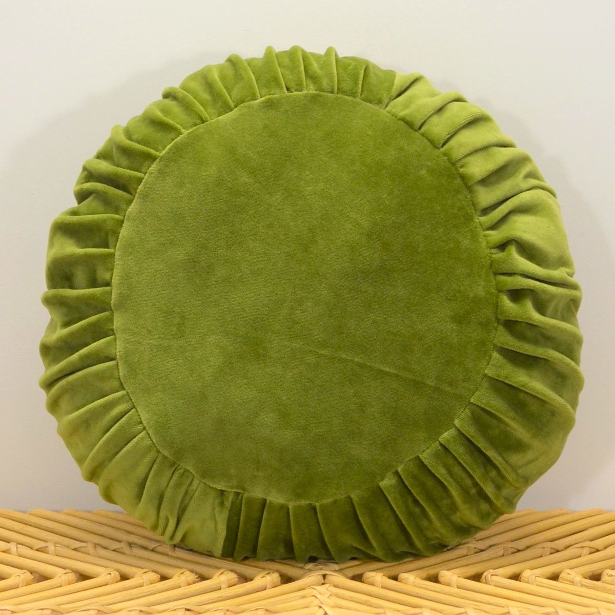 Coussin rond garni en velours plissé